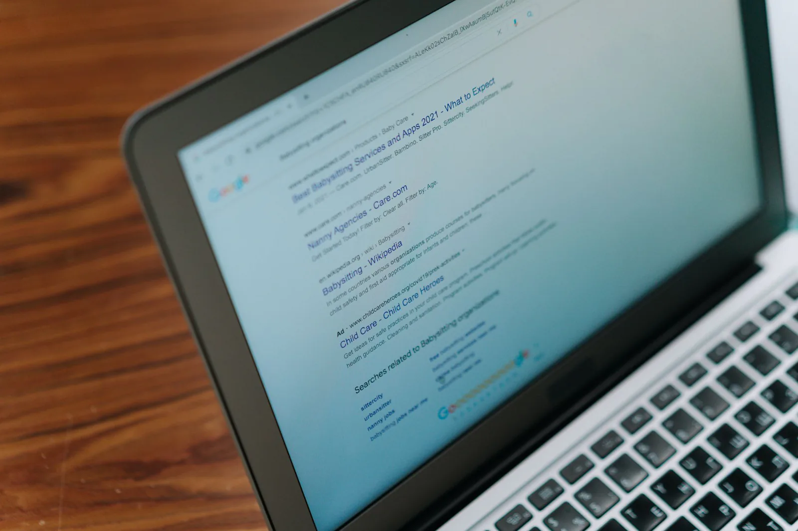 Laptop showing a domain name search page on screen