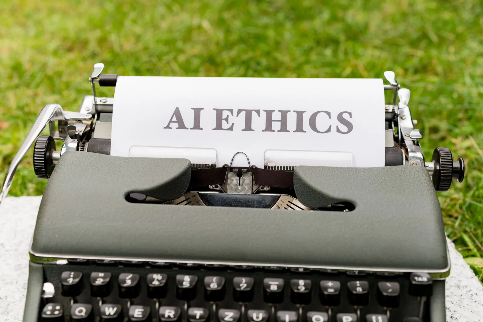 Vintage typewriter displaying AI ethics text, symbolizing the intersection of regulation and artificial intelligence