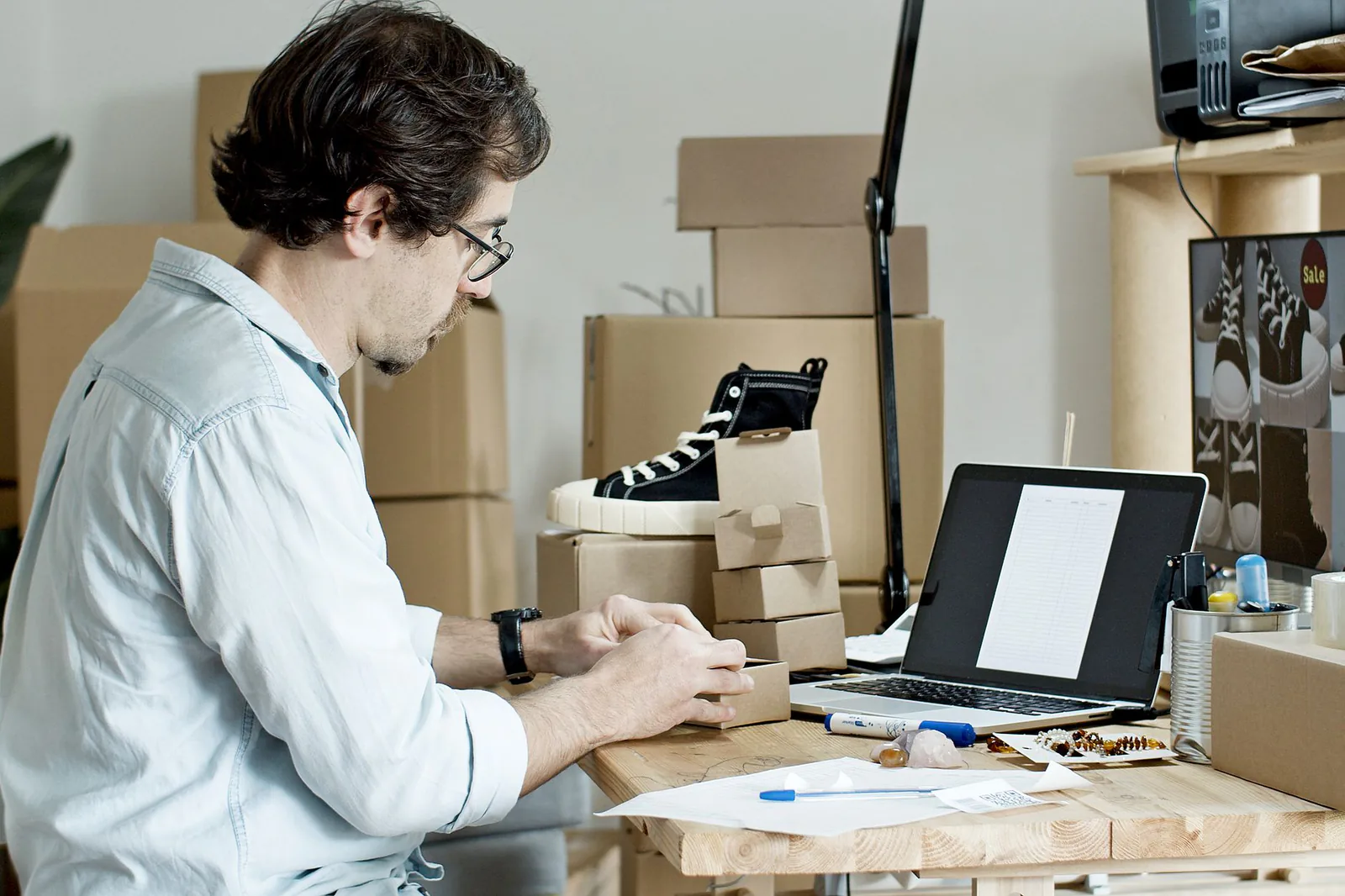 Business owner packing products for an online store