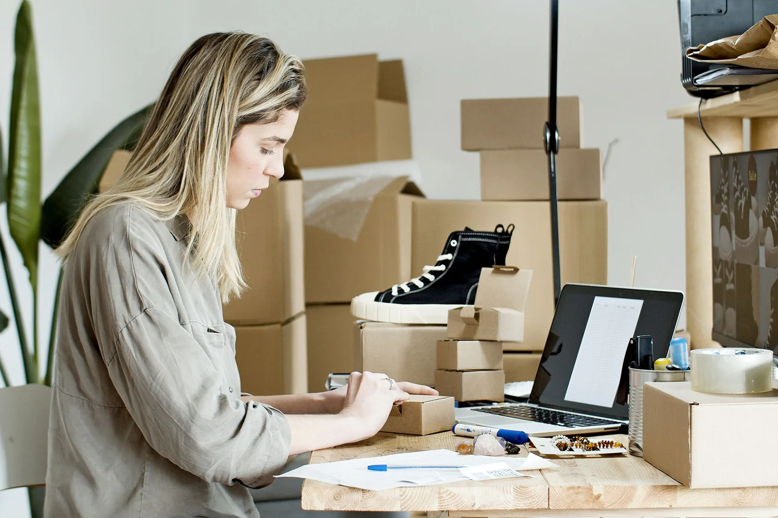 Small business owner packing products for online store orders