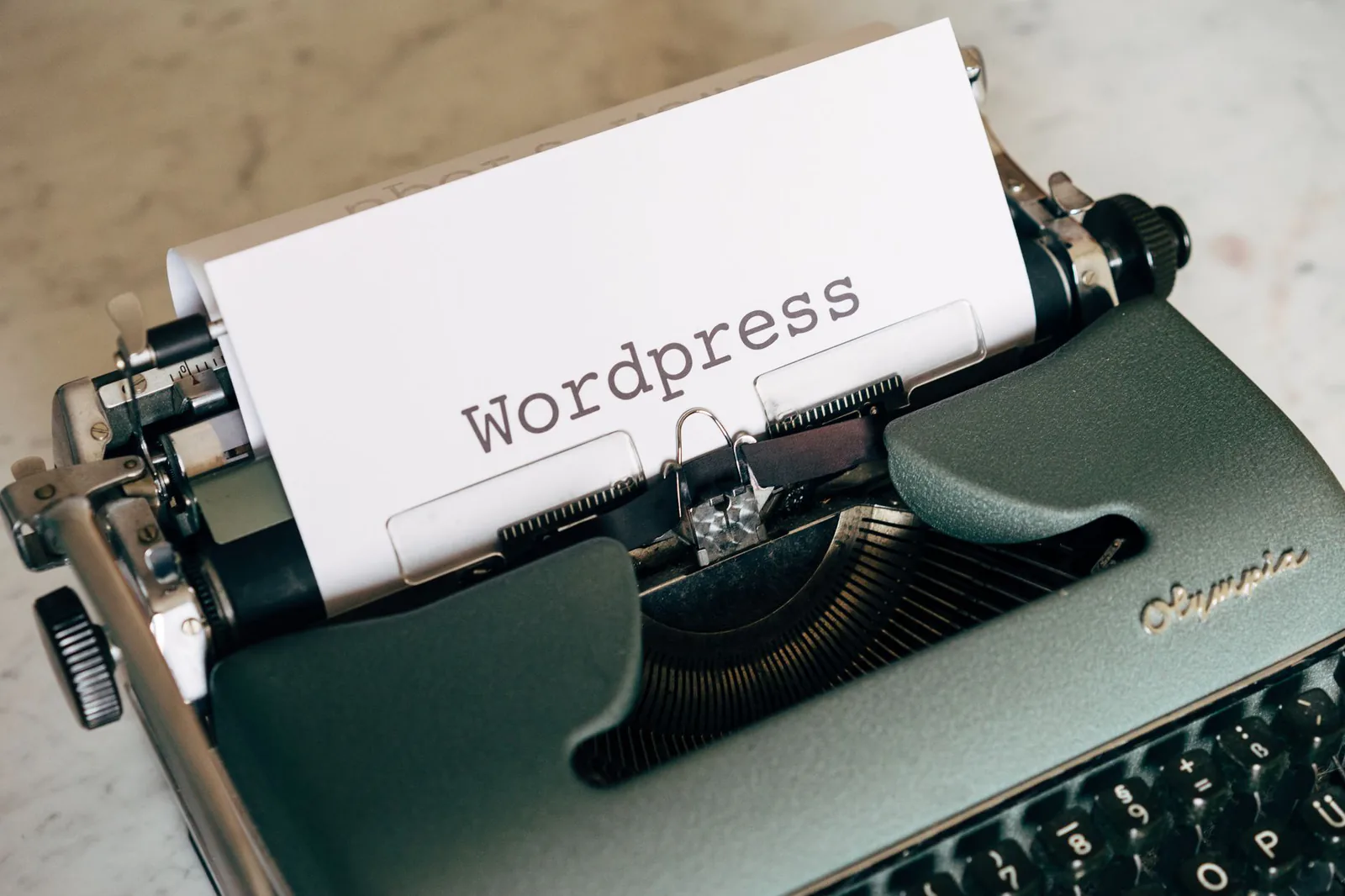 Vintage typewriter with a paper labeled WordPress